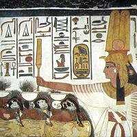 Nefertari consecrates food offerings to the god Atum - image from her tomb.