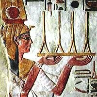 Nefetari makes an offering of fabric - image from her tomb in the Valley of the Queens. 